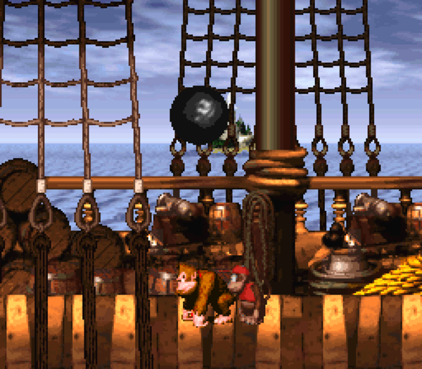 Donkey Kong about to be hit by cannonballs