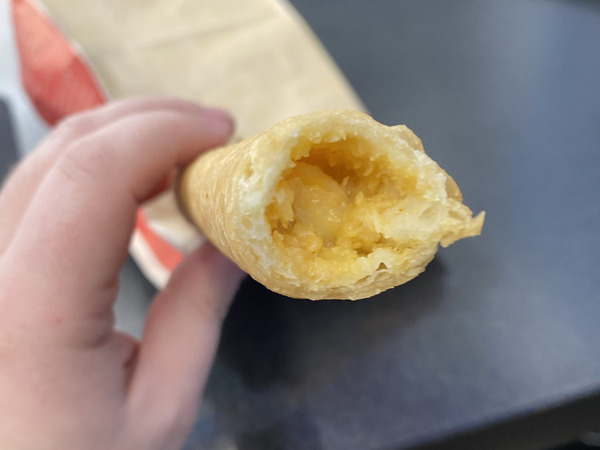 A bite of a flauta. This one looks pale and sad.