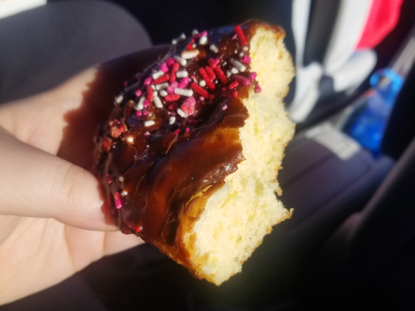 A partially-eaten donut with no visible filling.