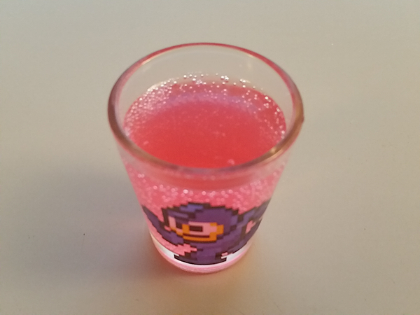 The soda poured out into the Mega Man shotglass