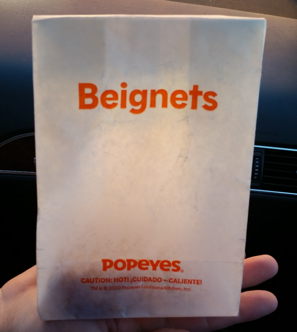 The tiny bag of beignets.